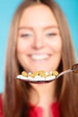 Young woman eating pills on a spoon Royalty Free Stock Photo