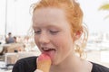 Young Woman Eating Pink Ice Cream on Cone Outdoors Royalty Free Stock Photo