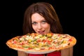 Young woman eating pizza Royalty Free Stock Photo