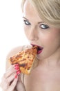 Young Woman Eating Pizza Slice Royalty Free Stock Photo