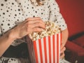 Young woman eating popcorn in movie theater Royalty Free Stock Photo