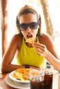 Young woman eating a portion of nachos with meat Royalty Free Stock Photo