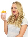 Young Woman Eating Potato Crisps Royalty Free Stock Photo