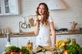 Young woman eating rye cracker crisp bread in the kitchen. Healthy Lifestyle. Health, Beauty, Diet Concept Royalty Free Stock Photo