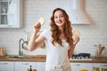Young woman eating rye cracker crisp bread in the kitchen. Healthy Lifestyle. Health, Beauty, Diet Concept Royalty Free Stock Photo