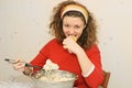 Young woman eating salad