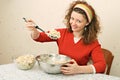 Young woman eating salad