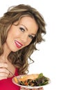 Young Woman Eating Salmon with Mixed Bean Salad Royalty Free Stock Photo