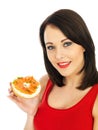 Young Woman Eating Smoked Salmon and Cream Cheese Bagel Royalty Free Stock Photo