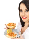Young Woman Eating Smoked Salmon and Cream Cheese Bagel Royalty Free Stock Photo