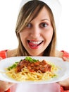 Young woman eating spaghetti