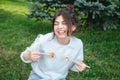 A young woman eating sushi in the park, picnic in nature. Royalty Free Stock Photo