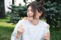 A young woman eating sushi in the park, picnic in nature. Royalty Free Stock Photo