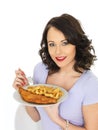 Young Woman Eating Traditional Fish and Chips Royalty Free Stock Photo