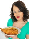 Young Woman Eating Traditional Fish and Chips Royalty Free Stock Photo