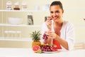 Young woman eating various fruit eating healthy on a diet Royalty Free Stock Photo