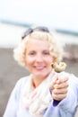 Young Woman Eating a Whelk (bourgot in french)