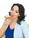 Young Woman Eating Wholegrain Cracker with Crunchy Peanut Butter and Sliced Banana