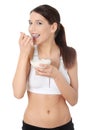 Young woman eating yoghurt Royalty Free Stock Photo