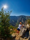 Young Woman at the edge of Mountain Gorge