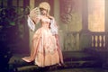 Young woman in eighteenth century image posing in vintage exterior Royalty Free Stock Photo