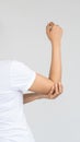 Young woman with elbow pain, medical concept