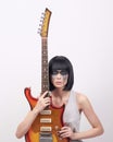 Young woman with electric guitar