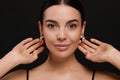 Young woman with elegant pearl earrings on black background Royalty Free Stock Photo