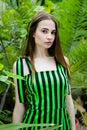 Young woman in elegant striped dress