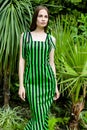 Young woman in elegant striped dress