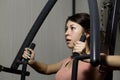 Young woman is engaged in sports and gymnastics in the gym Royalty Free Stock Photo