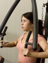 Young woman is engaged in sports and gymnastics in the gym Royalty Free Stock Photo