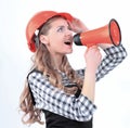 Young woman engineer with a megaphone .isolated on white Royalty Free Stock Photo