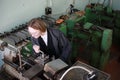 Young woman engineer working at machine tool Royalty Free Stock Photo