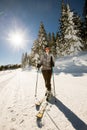 Young woman enjoing winter day of skiing fun in the snow Royalty Free Stock Photo