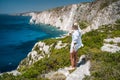 Young woman enjoy doastline on Plakaki Cape, Zakynthos Island, Greece