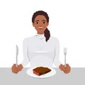 Young woman enjoy eating steak in the dish holding knife and fork as she is ready to eat Royalty Free Stock Photo