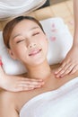 A young women lying in bed enjoying massage Royalty Free Stock Photo
