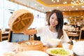 Young Woman enjoy meal in chinese restaurant Royalty Free Stock Photo