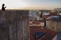Young woman enjoy the sunset from viewpoint at Coimbra Old Town, Portugal Royalty Free Stock Photo