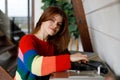 Young woman enjoying analog music in home interior. Listening to vinyl records Royalty Free Stock Photo