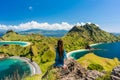 Young woman enjoying the awesome view of Padar Island during sum