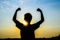 Young woman enjoying beautiful sun rise. Royalty Free Stock Photo