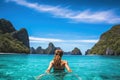 Young woman enjoying the beauty of a tropical island in Krabi, Thailand, A young woman swimming in clear sea water in a lagoon and