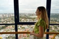 Young woman enjoying cityscape on the panoramic tower of Curitiba, Parana, Brazil Royalty Free Stock Photo