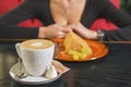 Young woman enjoying coffee time. Attractive caucasian girl in a cafe drinking a cup of coffee Royalty Free Stock Photo