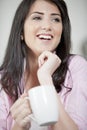 Young woman enjoying a cup of coffee