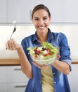 Fancy some salad. A young woman enjoying a delicious salad.