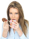 Young Woman Enjoying Drinking Tea and Eating Biscuits or Cookie Royalty Free Stock Photo