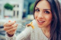 Young woman enjoying food in a restaurant, having her lunch break Royalty Free Stock Photo